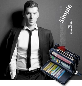 Deep blue leather clutch with dual zippers and multi-slot interior for cards and phone