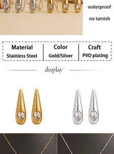 Macro detail of waterproof PVD gold and silver stainless steel teardrop jewelry set