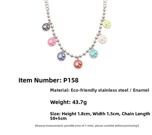 Detail of colorful solar and lunar enamel pendants on stainless steel ball chain necklace