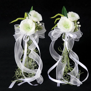 White and green artificial floral decorations for wedding wine glasses with pearls and ribbons