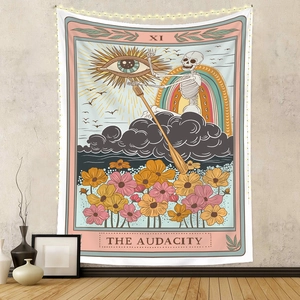 Detail of bohemian tarot tapestry featuring skeletons and the text The Audacity on a wall