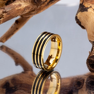 Men's minimalist stainless steel ring with three black stripes and polished gold finish