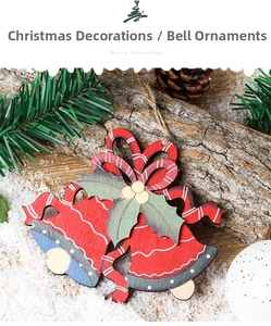 Close-up of wooden Christmas bells with holly and red bows on a snowy forest background