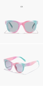 Detail view of pink and green gradient glitter frame round sunglasses with grey lenses