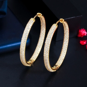 Detail of large 18K gold plated hoop earrings with micro-pave white zircon crystals