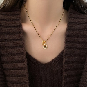 18K gold plated tiger eye stone gourd pendant necklace on female model with brown sweater
