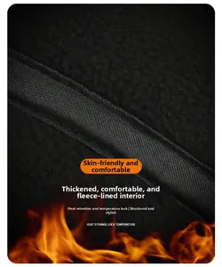 Detailed view of the thick black fleece lining and warm thermal fabric on winter cap