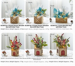 Detailed views of mini tabletop Christmas trees in wooden boxes with warm LED lights