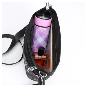 Interior view of the gothic skull crossbody bag showing large capacity for essentials
