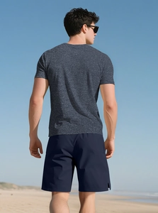 Rear view of a men's dark grey henley T-shirt and blue shorts for summer fitness
