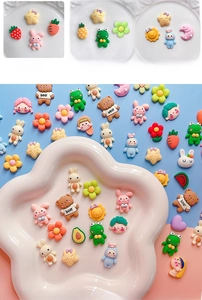 Close-up of cute 3D resin cartoon charms for DIY water bottle and phone case decoration