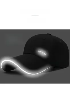 Macro detail of black quick-dry sports cap with reflective piping and SPORTS logo on side