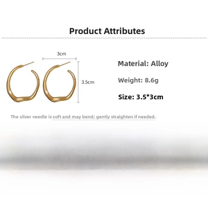Detailed specs of irregular gold hoop earrings with silver pins and 3.5cm size