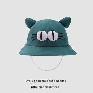 Detail of baby bucket hat with 3D cat ears and cartoon eye embroidery for outdoor shade