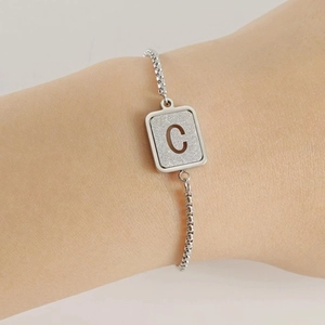 Minimalist stainless steel cuff bracelet featuring a frosted letter C pendant for women