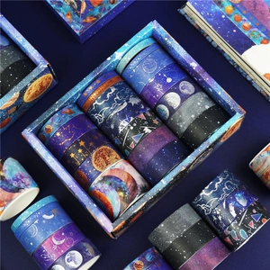 Detailed view of galaxy themed washi tape set with gold and silver foil star patterns