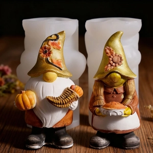 Detail of harvest gnome silicone mold set featuring a gnome with pumpkin and pie figurines
