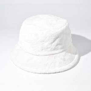 Detail showing the thick, soft white faux fur texture of the winter bucket hat