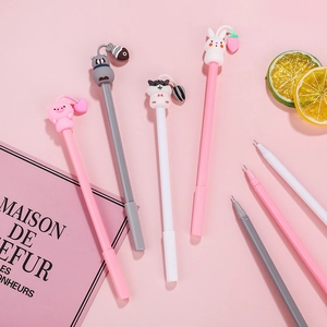 Set of four cute animal gel pens with pig cat hamster and rabbit toppers on pink background