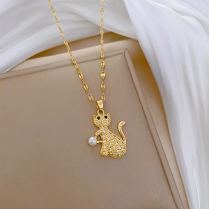 Titanium gold necklace featuring a luxury crystal-pave cat pendant with a white pearl