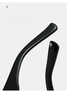 Close-up of ergonomic curved temple tips on glossy black retro sunglasses for comfort