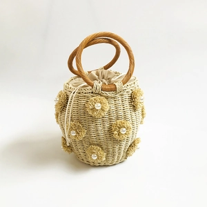 Handmade beige woven bucket bag with pearl flowers and circular wooden handles