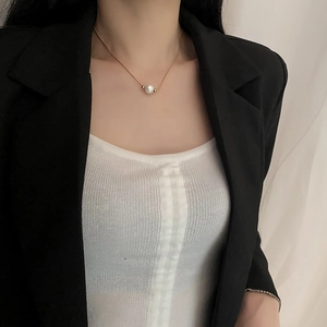 Minimalist 18K gold plated pearl necklace for women worn with professional black blazer