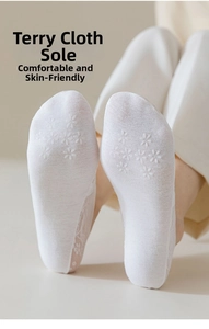 White lace invisible socks featuring a non-slip silicone plum pattern and towel cushioned sole