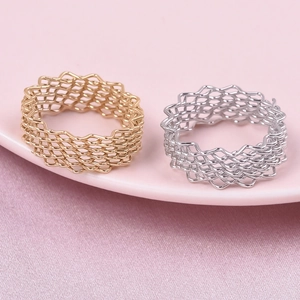 304 stainless steel rings with 18K gold mesh texture shown on a soft pink plate
