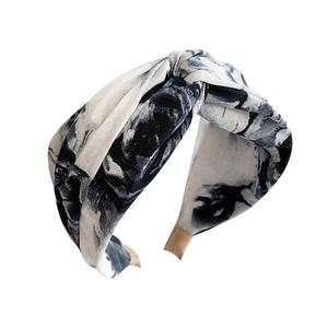 Wide tie-dye headband with a stylish knotted design and monochrome marble pattern
