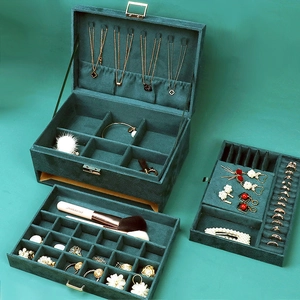 Emerald green velvet jewelry organizer box with three layers and locking mechanism