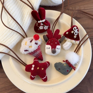 Set of 6 cute Christmas hair ties with plush rabbit, reindeer and star on a plate