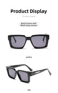 Detail view of square black sunglasses with grey lenses and metal arrow temple accent