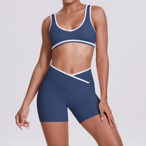 Detail of high-stretch sports set with V-cross waistband and white contrast trim
