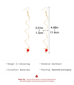Technical drawing of gold spiral earrings with red beads showing 11.4cm length detail