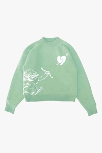 Dettaglio maglione in maglia verde menta con motivo jacquard bianco cupido e cuori
