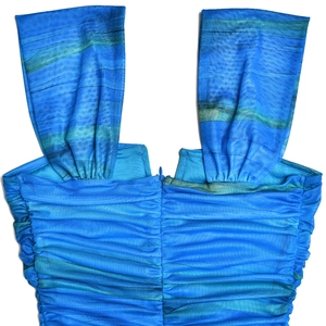 Close-up detail of the back view showing ruched texture on blue floral fishtail dress