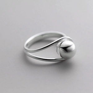 Minimalist silver spherical bead ring with polished finish shown from a 45-degree angle