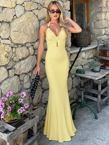 Sexy yellow halter neck bodycon maxi dress with front knot and cutout details for summer