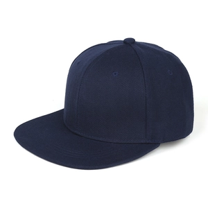 Detailed view of navy blue cotton twill fabric and six-panel stitching on flat brim hat