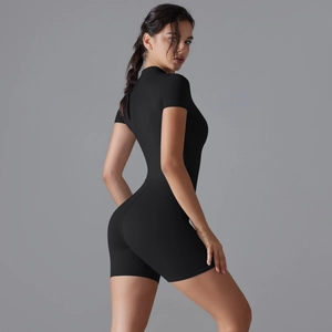 Close-up of sleek black yoga bodysuit showing high-stretch fabric and slim fit design