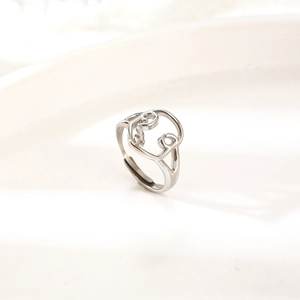 Abstract hollow face open ring in polished silver stainless steel for a minimalist look