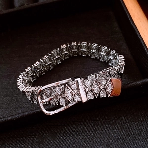 Detail of silver belt buckle bracelet with micro-pave cubic zirconia in jewelry box
