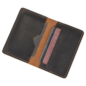Detail of crazy horse leather wallet showing dual card slots and vintage stitching