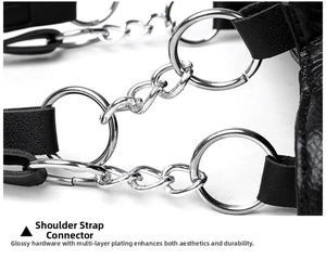 Detail of black leather shoulder strap with silver metal chain link and ring connection
