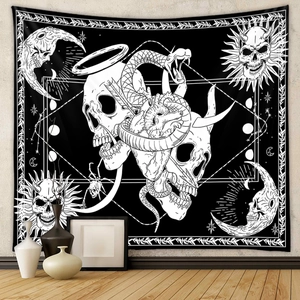 Detail showing gothic black and white tapestry with skull heart and snake patterns on wall