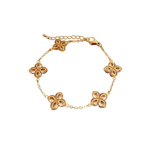 Elegant gold clover bracelet featuring five hollow floral charms with sparkling crystals