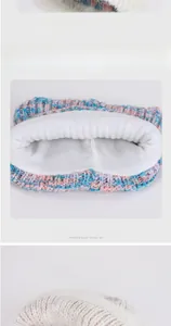 Detail of color-mix knit winter hat with thick white fleece lining for warmth