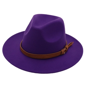 Detail of purple felt jazz hat featuring a brown leather belt buckle accessory