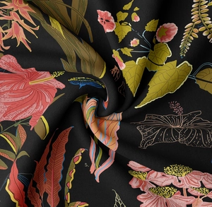 Close-up of high-quality fabric texture with vibrant tropical floral pattern on black